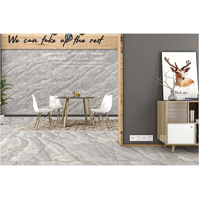 Feinsteinzeugfliese MARVEL GREY – 60 x 120 cm, Marmoroptik, Mat -  - Hellgraue Fliesen mit Marmormuster bedecken Boden und Wand in einem modernen Essbereich und verleihen eine edle Ästhetik.