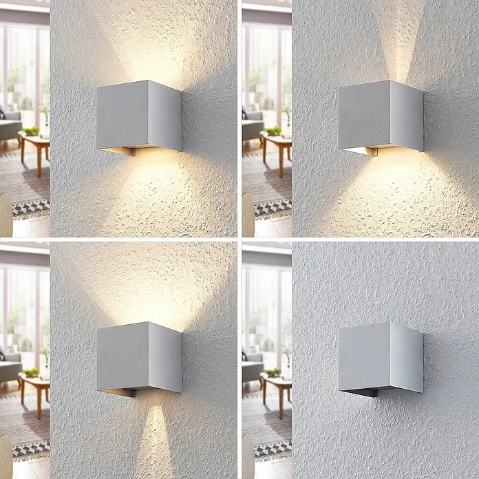 Arcchio Wandleuchte innen in aluminium, Wandlampe -  - Silberne kubische Wandleuchte an strukturierter Wand, die warmes Licht nach oben und unten wirft.