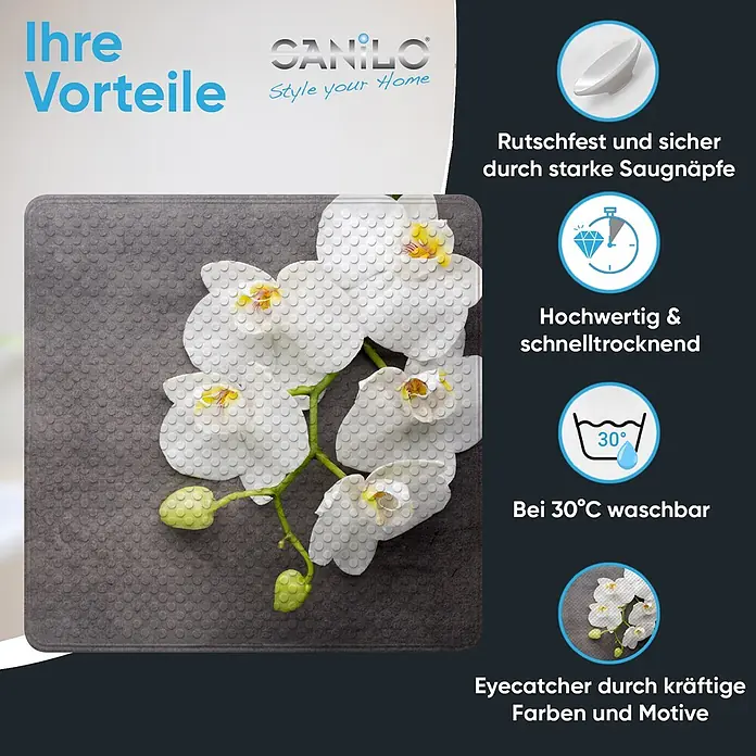 Badematte Pretty -  - Eine dunkelgraue, texturierte Anti-Rutsch-Badematte mit weißen Orchideenblüten, die ihre schnelltrocknenden und waschbaren Eigenschaften hervorhebt.