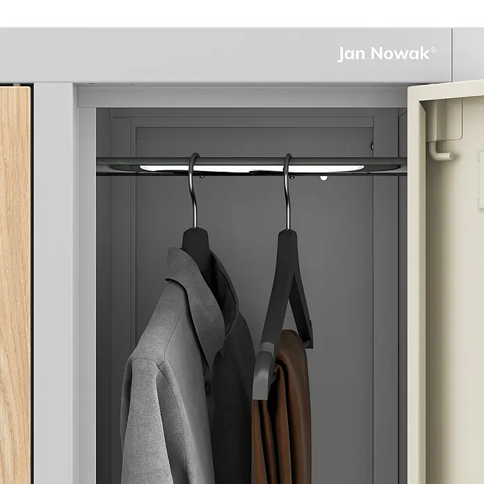 Jan Nowak Kleiderschrank BARTEK, 10-türig, 136x172x45 cm, Grau/Eiche Sonoma -  - Kleiderschrank-Innenraum mit Kleiderstange, LED-Beleuchtung, grauem Hemd und brauner Hose.