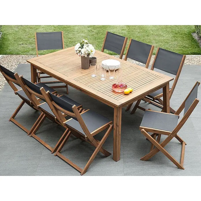 9-tlg Gartentisch Set CESANA in Braun/Grau -  - Gartenset aus Holz mit Lamellentisch und passenden Klappstühlen mit dunkelgrauem Stoff auf einer Terrasse.