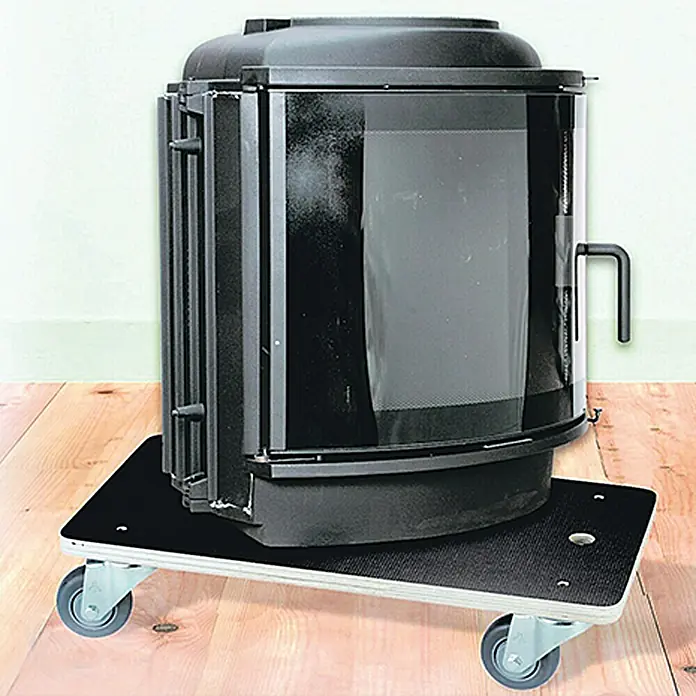 Wagner System Base con ruedas Cargo Professional - L x An x Al: 59 x 39 x 12 cm, Capacidad de carga: 500 kg, Plástico - Estufa de leña negra sobre una plataforma con ruedas. Permite un fácil movimiento de la estufa en la habitación, proporcionando flexibilidad en el diseño.
