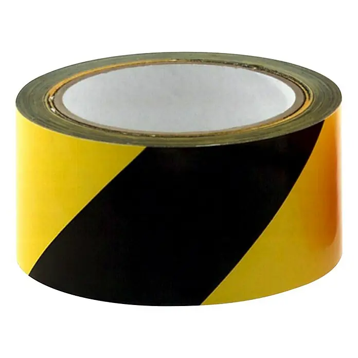 Stabilit Cinta de bloqueo - An x L: 50 mm x 66 m, Amarillo/Negro - Primer plano de un rollo de cinta de peligro con franjas negras y amarillas sobre un fondo negro.