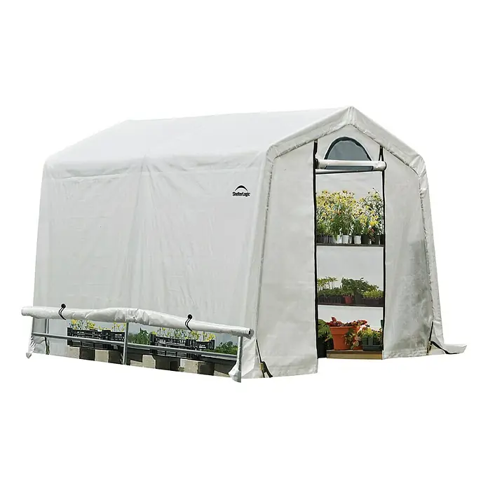 ShelterLogic Gewächshaus - Außenmaß inkl. Dachüberstand (B x T): 240 x 240 cm, Grau, Grundfläche: 5,76 m² - Bild eines ShelterLogic Gewächshauses mit Pflanzenregalen. Ideal für den Garten, um Pflanzen vor Witterung zu schützen und anzuziehen.
