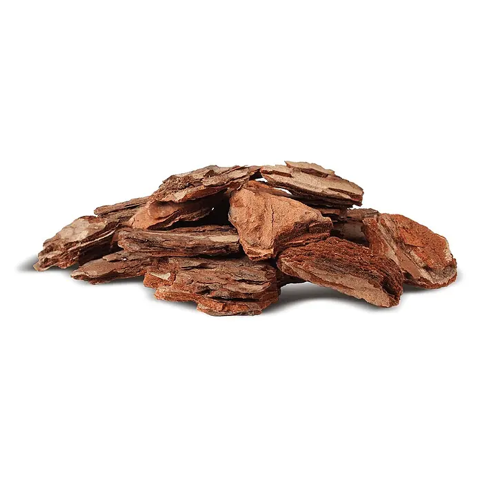 Rindenmulch Pinie Deko Plus 60-100 mm 60l x 12 Sack 720l 12er Palette -  - Haufen rötlich-brauner Holzrindenstücke mit unregelmäßigen Formen und natürlicher Textur.