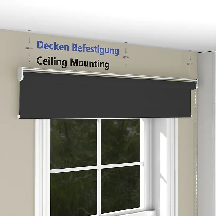 Tageslichtrollo blickdicht Wand und Deckenmontage schwarz 70x220 cm -  - Dunkelgraues Rollo mit weißem Gehäuse, an der Decke über einem Fenster montiert. Zeigt die Deckenbefestigung für Rollos.