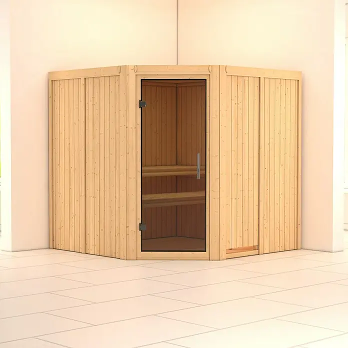 Karibu Elementsauna Jarin - Ohne Ofen, Ohne Dachkranz, Materialspezifizierung Tür: Ganzglas Graphit, L x B x H: 196 x 196 x 192 cm - Eine helle Holzsauna mit einer Glastür, die Einblick auf die Holzbänke im Inneren bietet, vor einer cremefarbenen Wand.