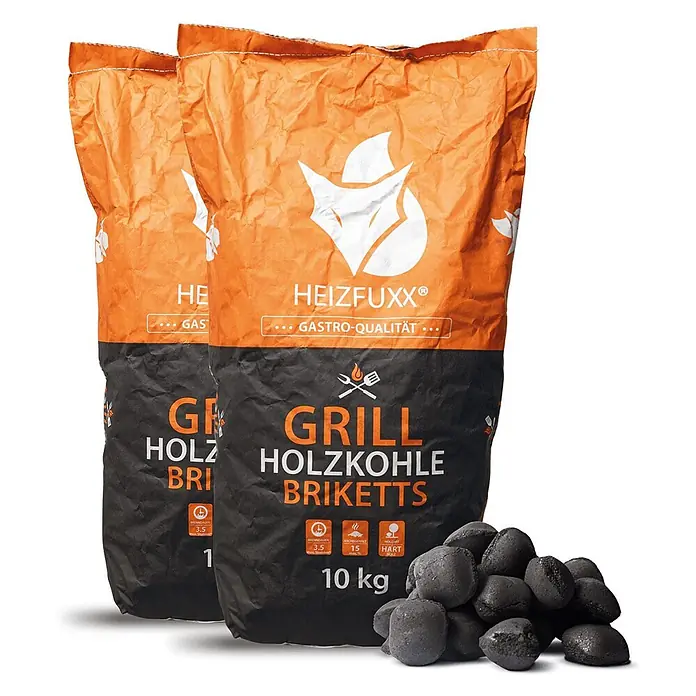 Grillholzkohlebriketts 10kg x 2 Sack 20kg -  - Zwei orange-schwarze Säcke Grill-Holzkohlebriketts und ein Haufen dunkler Briketts.