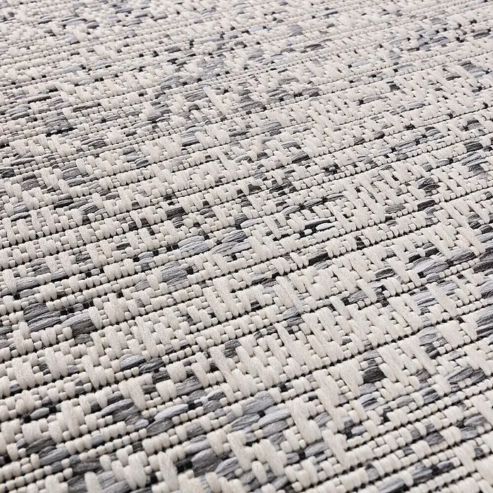 Dekoria Teppich Breeze charcoal/grey 120x170cm -  - Nahaufnahme eines gewebten Teppichs mit strukturierter Musterung in Hellbeige und Grautönen.