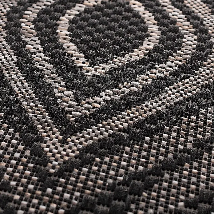 Dekoria Teppich Breeze black/ clif grey 120 x 170 cm -  - Nahaufnahme eines gewebten Teppichs mit erhabenen schwarzen geometrischen Mustern auf hellgrauem Grund.