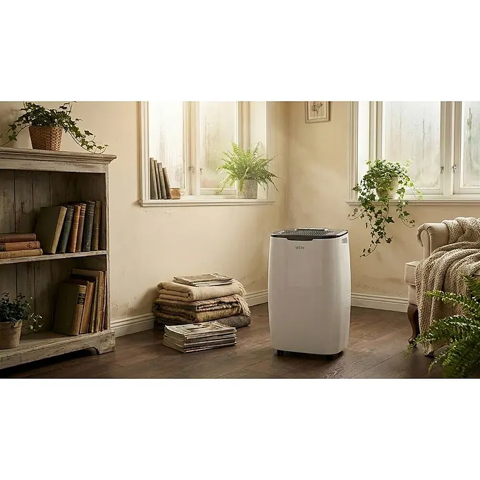 WDH Luftentfeuchter WDH-416S - für 40m² - 20 Liter/Tag -  - Weißer WDH Luftentfeuchter in einem gemütlichen Raum, der seine Integration zu Hause zeigt.