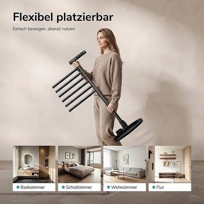Elektro-Badheizkörper PCR2 1000 × 539 × 350 mm Mattschwarz -  - Frau trägt schwarzen tragbaren Wäschetrockner, flexible Nutzung in Bad, Schlafzimmer, Wohnzimmer, Flur demonstriert.
