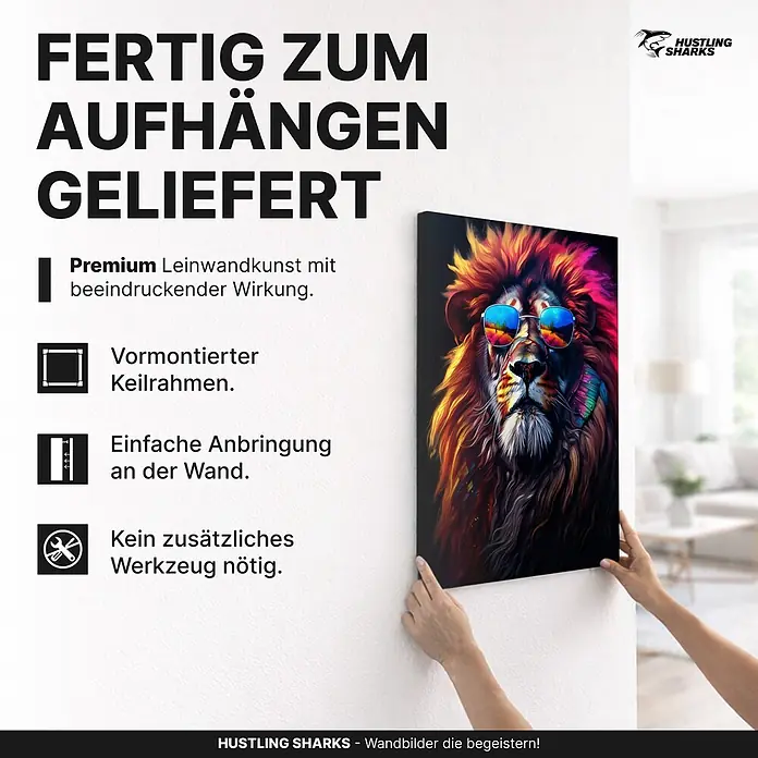 Hustling Sharks Leinwandbild Lion Cool, B x H: 30 x 40 cm -  - Eine Person hängt ein vormontiertes Leinwandbild eines bunten Löwen mit Sonnenbrille an eine Wand.