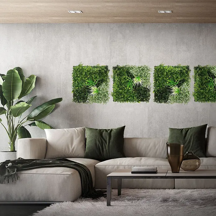 Künstliche Pflanzenwand Kunstpflanzen Wand Innen Aussen White Blossom -  - Vier quadratische Paneele aus künstlichen Grünpflanzen bilden eine grüne Wanddekoration über einem Sofa.