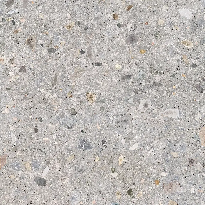 Feinsteinzeug in matter hellgrauer Steinoptik 120x120 - Ital. Fliesen -  - Graue Terrazzo-Oberfläche mit verstreuten, mehrfarbigen Steinsplittern. Ideal für robuste Böden oder Wandverkleidungen.