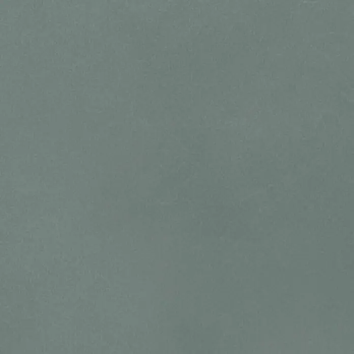 Feinsteinzeug in farbiger salbeigrüner Betonoptik 60x60 - Ital. Fliesen -  - Nahaufnahme eines strukturierten blaugrauen Materials.