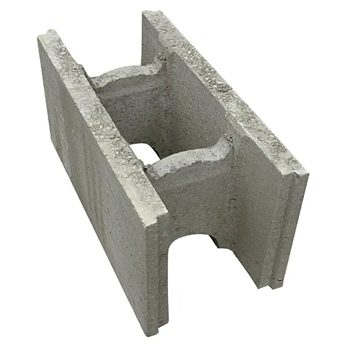 EHL Schalungsstein - 50 x 24 x 25 cm - Das Bild zeigt einen einzelnen grauen Hohlblockstein, der typischerweise im Bauwesen für Mauern verwendet wird. Die Textur des Steins ist rau und ungleichmäßig.