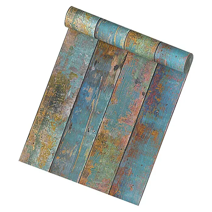 A.S. Création Vliestapete HolzbrettBunt, Holzoptik, 10,05 x 0,53 m - Nahaufnahme einer Rolle Vinyltapete in Holzoptik mit blauem und braunem Farbmuster.