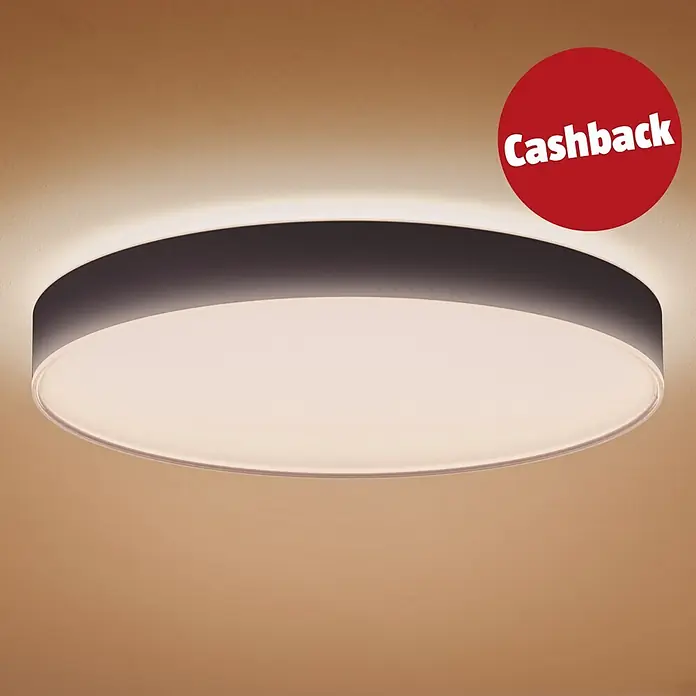 Philips Hue LED-Deckenleuchte rund White Ambience Enrave XL - 48 W, Ø x H: 55,1 x 8,4 cm, Schwarz, Kaltweiß - Runde, flache LED-Deckenleuchte mit dunkelgrauem Rand und rotem „Cashback“-Aufkleber, die eine warm getönte Decke beleuchtet.