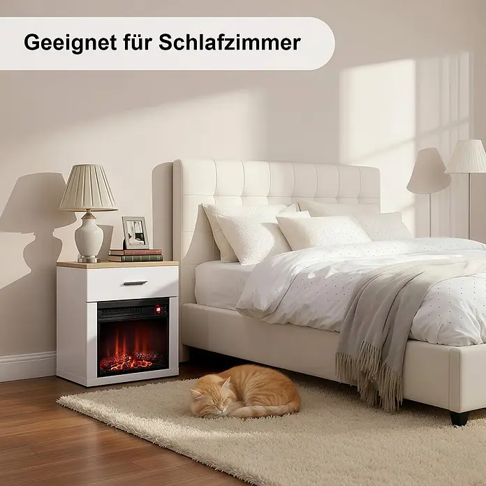 HOMAVO 14'' 1000W Elektrokamin mit Nachttisch -  - Weißer Nachttisch mit Elektrokamin in einem Schlafzimmer, neben einem Bett mit einer schlafenden Katze auf dem Teppich.
