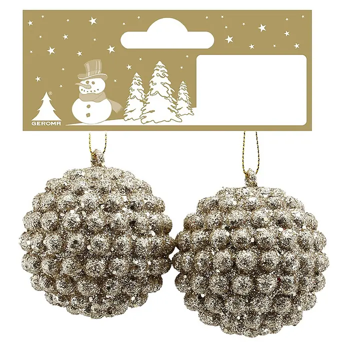 Geroma Christbaumschmuck - Champagne, Kunststoff, Rund, 2 Stk. - Zwei funkelnde champagnerfarbene Glitzer-Christbaumkugeln, hängend an einem goldenen Weihnachtsetikett mit Schneemann und Bäumen.