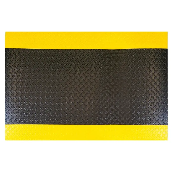 PROREGAL Anti-Ermüdungsmatte COMFORT mit Grid-Profil Grau -  - Schwarze Anti-Ermüdungsmatte mit Riffelblechmuster und leuchtend gelben Sicherheitsrändern.