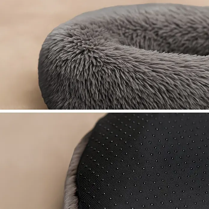 belviona Donut-Katzenbett 40 cm, flauschiges Plüschbett, anthrazit -  - Nahaufnahme eines flauschigen grauen Haustierbetts, das sein weiches Material und eine rutschfeste Unterseite mit Noppen zeigt.