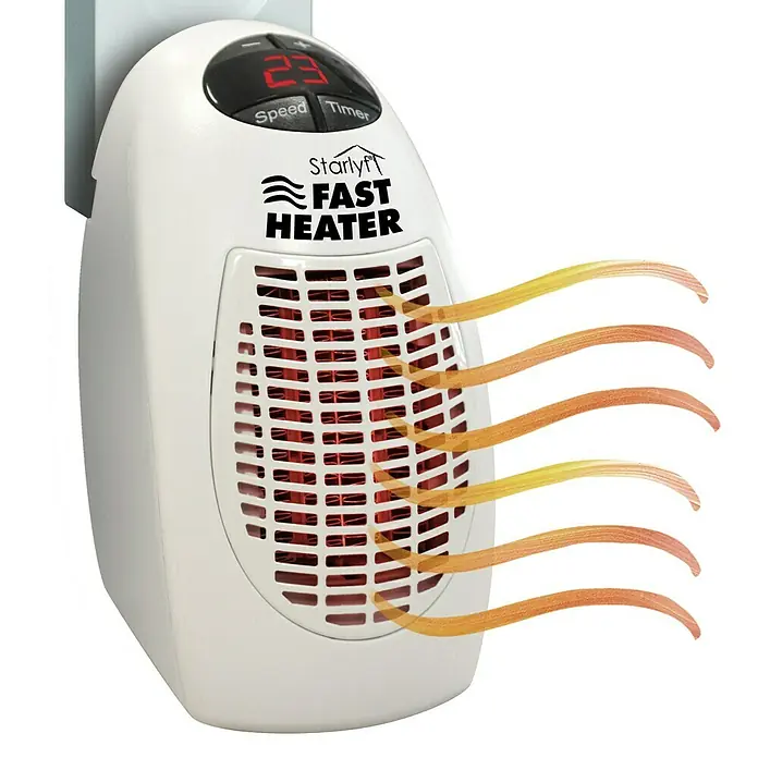 Heizlüfter Starlyf Fast Heater - 400 W, Weiß - Bild eines tragbaren Starlyf Fast Heater, der in eine Steckdose gesteckt ist und warme Luft ausstößt.