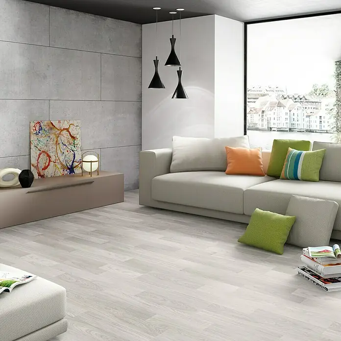 LOGOCLIC Laminado Roble Soho - 1.200 x 196 x 10 mm, Roble Soho, AC5 - Luminoso salón con sofá moderno, lámparas elegantes y suelo de madera gris que añade un toque elegante al espacio.