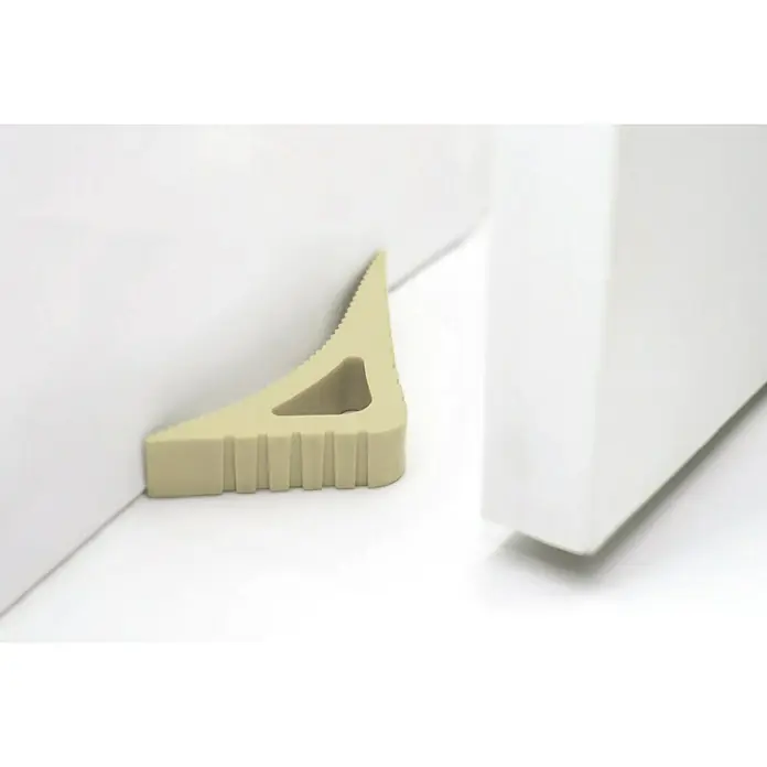 Retenedor para puerta y ventana Blockystar - Beige - Tope de puerta de goma beige entre una puerta y un marco, manteniendo la puerta abierta. Diseño práctico y sencillo para uso diario.
