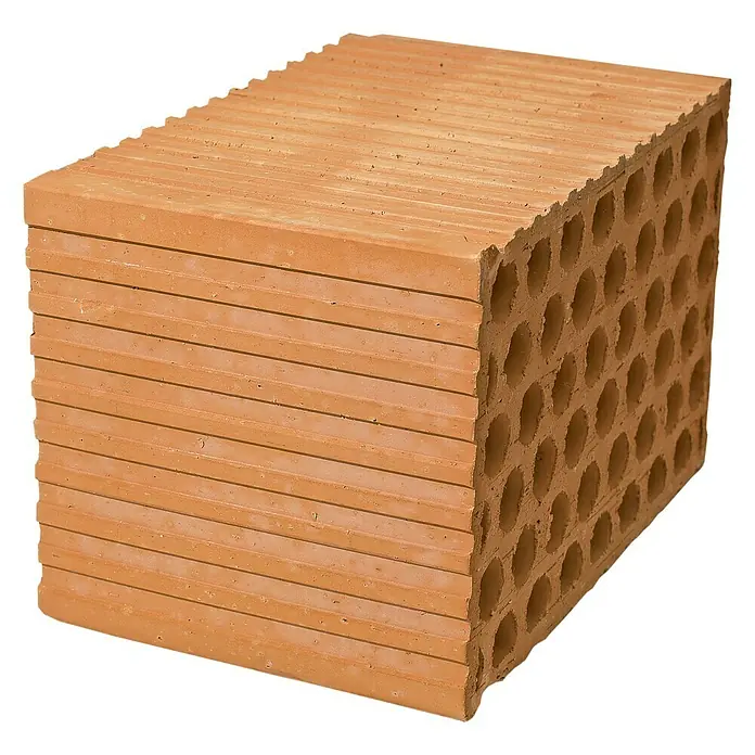 BHS Mallorca Ladrillo panal - 19 x 29 cm, Rojo - Primer plano de una pila de bloques de ladrillo hueco de color marrón claro. Los ladrillos son rectangulares con un patrón de agujeros.