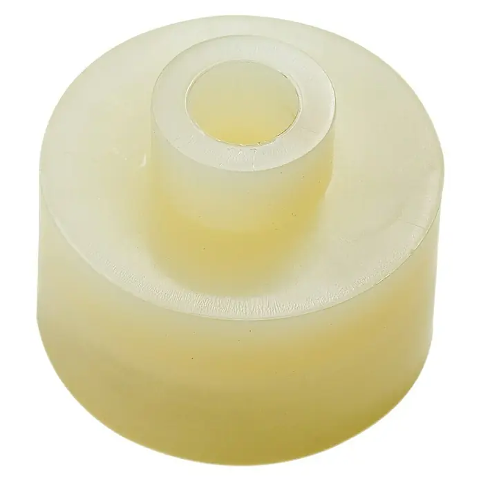 Acoplamiento para tubo - 1 ud. - Primer plano de un cojinete liso cilíndrico beige con un orificio centrado, sobre una superficie blanca.
