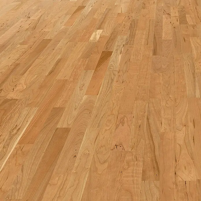 Living by Haro Parkettmuster Amerikanischer Kirschbaum - 290 x 180 x 135 mm, Schiffsboden - Nahaufnahme eines hellen, hochwertigen Parkettbodens mit deutlicher Holzmaserung und warmer Farbgebung. Der Bodenbelag verleiht jedem Raum eine natürliche Eleganz.