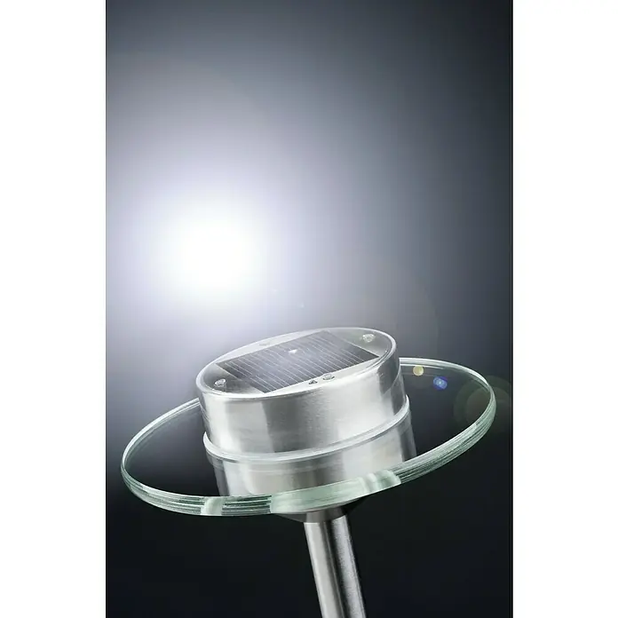 Paulmann Special Line Solarleuchte Ufo - Edelstahl, Höhe: 55 cm, LED - Nahaufnahme einer Solarleuchte mit Glasring und silbernem Finish vor einem unscharfen Hintergrund.
