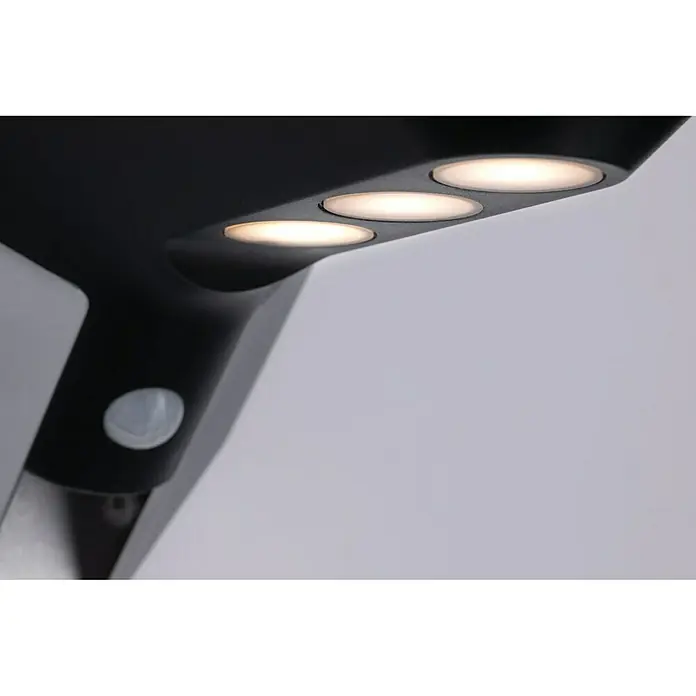 Paulmann Soley Solar-Außenwandleuchte - 1,2 W, L x B x H: 24 x 10,4 x 10 cm, Anthrazit, IP44 - Nahaufnahme einer modernen, schwarzen Solarleuchte mit Bewegungssensor und drei LED-Leuchten, die warmes Licht ausstrahlen.