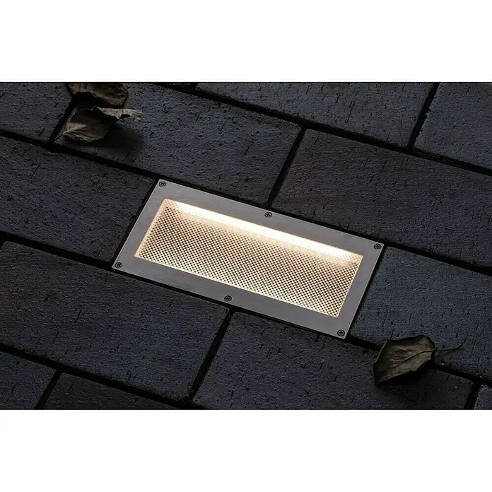 Paulmann Foco para empotrar en suelo Aron - 1,5 W, Blanco, L x An: 10 x 20 cm - Luz de suelo empotrada con cubierta de malla, incrustada en pavimento oscuro. Proporciona iluminación ambiental en áreas exteriores.