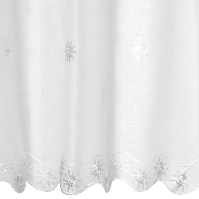 Elbersdrucke Bistrogardine Valley - 148 x 46 cm, 100 % Polyester, Offwhite - Detailaufnahme einer weißen Gardine mit Blumenmuster am unteren Rand, die eine elegante und luftige Atmosphäre erzeugt.