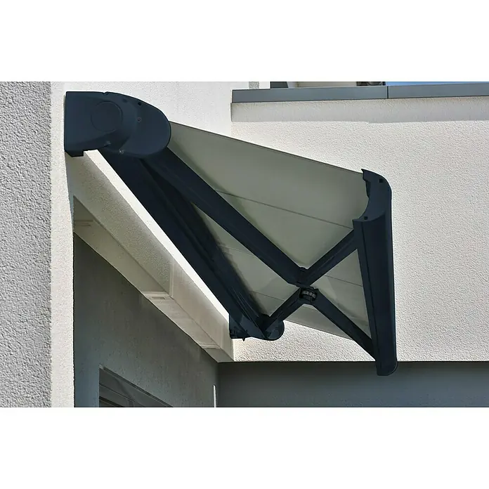 Deyo Limassol Vollkassettenmarkise - Grau, Farbe Gestell: Anthrazitgrau Feinstruktur, Breite: 3,5 m, Ausfall: 3 m - Eine moderne Markise in Grau ist an einer weißen Hauswand befestigt und bietet Schatten. Die Markise ist teilweise ausgefahren.