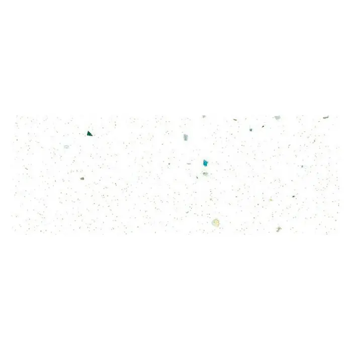 Maderas Daganzo Canto para encimera Fantasia Blister - Blanco, 650 x 45 mm - Primer plano de una superficie blanca con pequeñas salpicaduras de colores.
