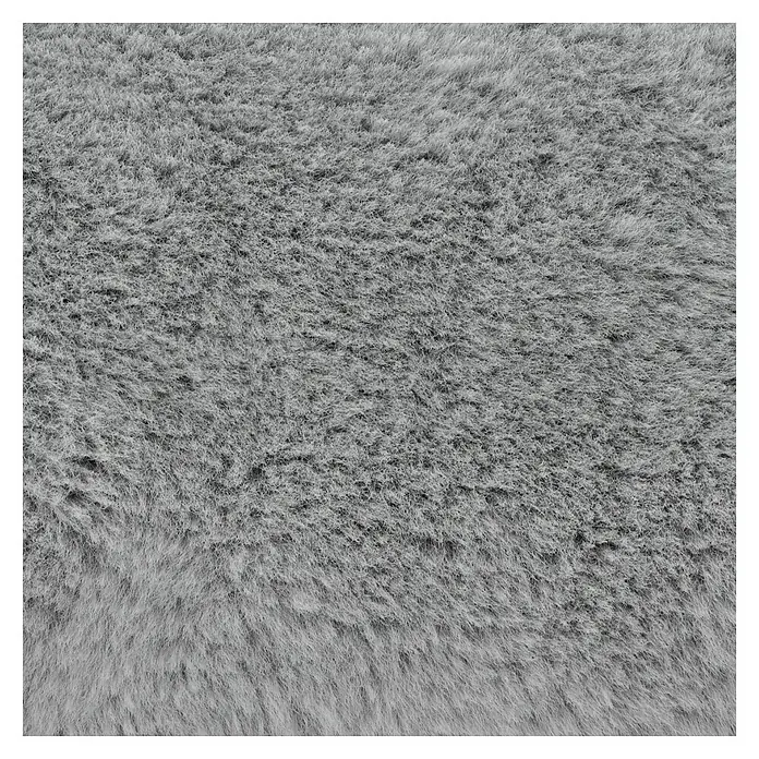 Decke Happy - Silber, 200 x 150 cm, 100 % Polyester - Nahaufnahme eines weichen, grauen Teppichs, der eine flauschige Textur und einen gemütlichen Komfort bietet.