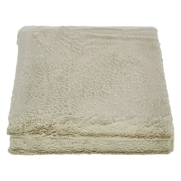 Manta para sofá Happy - 150 x 200 cm, Beige - Primer plano de una manta de franela súper suave, color crema y plegada, con una textura de felpa, ideal para comodidad y calidez.