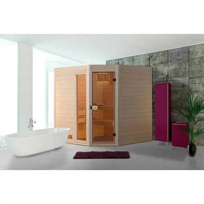 Finnwood Massivholzsauna Lasse 3 - Elektroofen, Steuerung Ofen: Integriert, L x B x H: 172 x 189 x 203 cm - Holzsauna-Ecke in einem modernen Badezimmer mit Badewanne und violetten Möbeln. Die Ecksauna verfügt über eine Glastür.