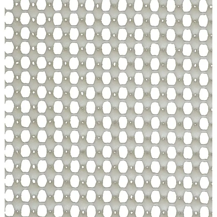 Protección antideslizante para alfombras - 120 x 60 cm, Se puede cortar - Primer plano de un patrón de alfombra antideslizante gris con recortes ovalados. Ideal para baño o cocina para minimizar riesgos de resbalones.