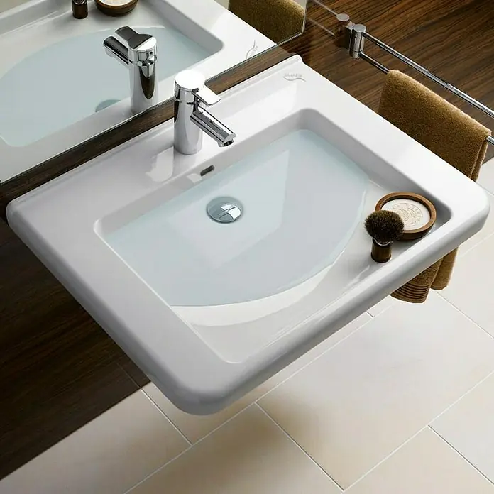 Geberit Renova Comfort Waschtisch - 55 x 52,5 cm, Mit schmutzabweisender Glasur, Hahnloch: Mitte, Mit Überlauf, Weiß - Elegantes, rechteckiges Waschbecken aus Keramik mit moderner Armatur, Abfluss und stilvollem Zubehör für die tägliche Badroutine.