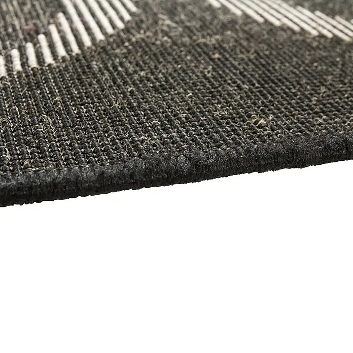 Outdoor-Teppich Finca - Graphit, 230 x 160 cm, 100 % Polypropylen - Detailaufnahme eines schwarzen Teppichs mit weißen Mustern, der Textur und Verarbeitung hervorhebt.