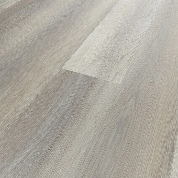 Vinylbodenmuster Strong SPC Hexenberg - 280 x 160 x 3,8 mm, Landhausdiele - Nahaufnahme von hellem Laminatboden. Die Holzstruktur ist gut sichtbar und verleiht dem Boden ein natürliches Aussehen.