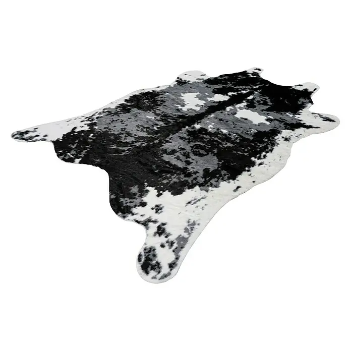 Kayoom Kunstfell Desert - Schwarz/Weiß, 230 x 160 cm, 85 % Acrylic, 15 % Polyester - Schwarzer und weißer Kuhfellteppich mit einzigartigen Fleckenmustern, ideal für rustikale oder moderne Einrichtungen.