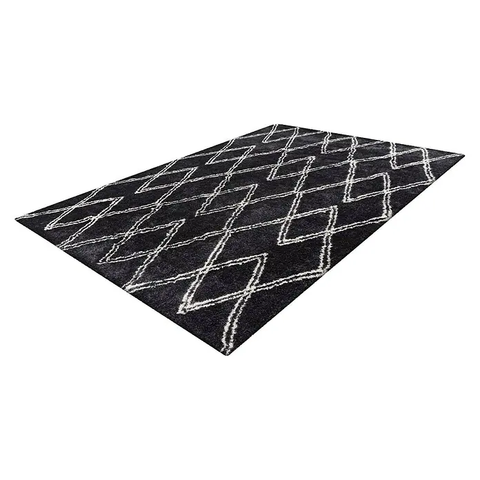 Kayoom Hochflorteppich Orlando 325 - Anthrazit, 150 x 80 cm - Schwarzer Teppich mit einem weißen geometrischen Zickzackmuster, ideal für moderne Wohnräume. Ein stilvolles und dekoratives Element für jeden Raum.