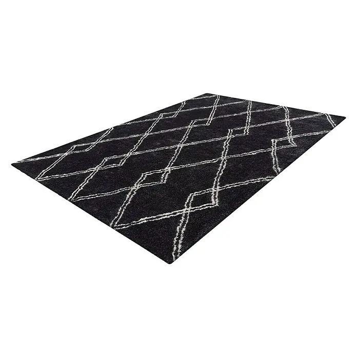 Kayoom Hochflorteppich Orlando 125 - Anthrazit, 230 x 160 cm - Ein rechteckiger, schwarzer Teppich mit einem hellen, geometrischen Rautenmuster, der eine moderne und stilvolle Atmosphäre schafft.