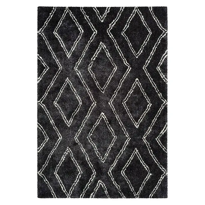 Kayoom Hochflorteppich Orlando 225 - Anthrazit, 170 x 120 cm - Ein rechteckiger, schwarzer Teppich mit einem auffälligen weißen Rautenmuster. Der Teppich hat eine weiche Textur und einen modernen Look.